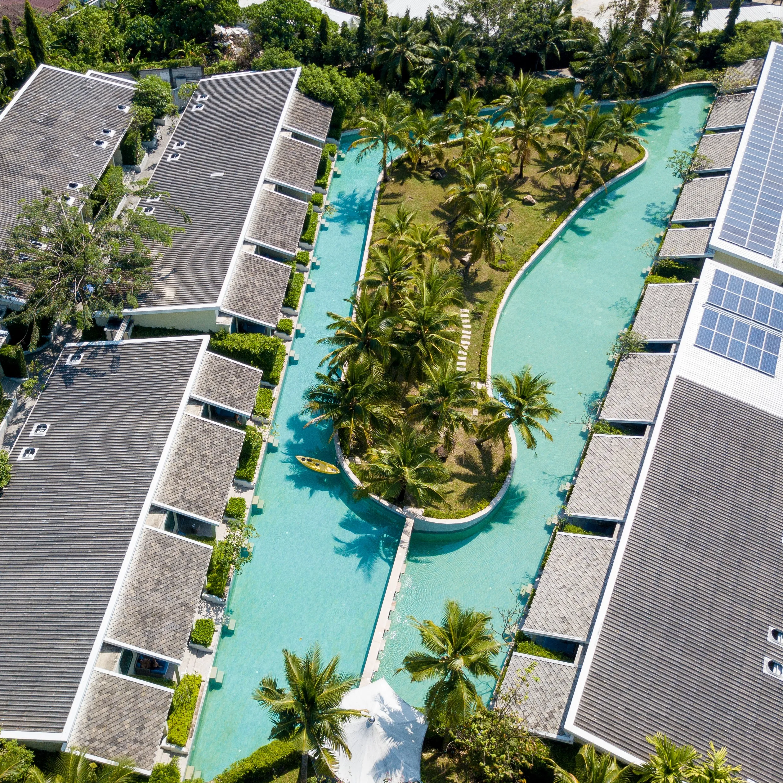 A drone shot of swimming pools in a hotel