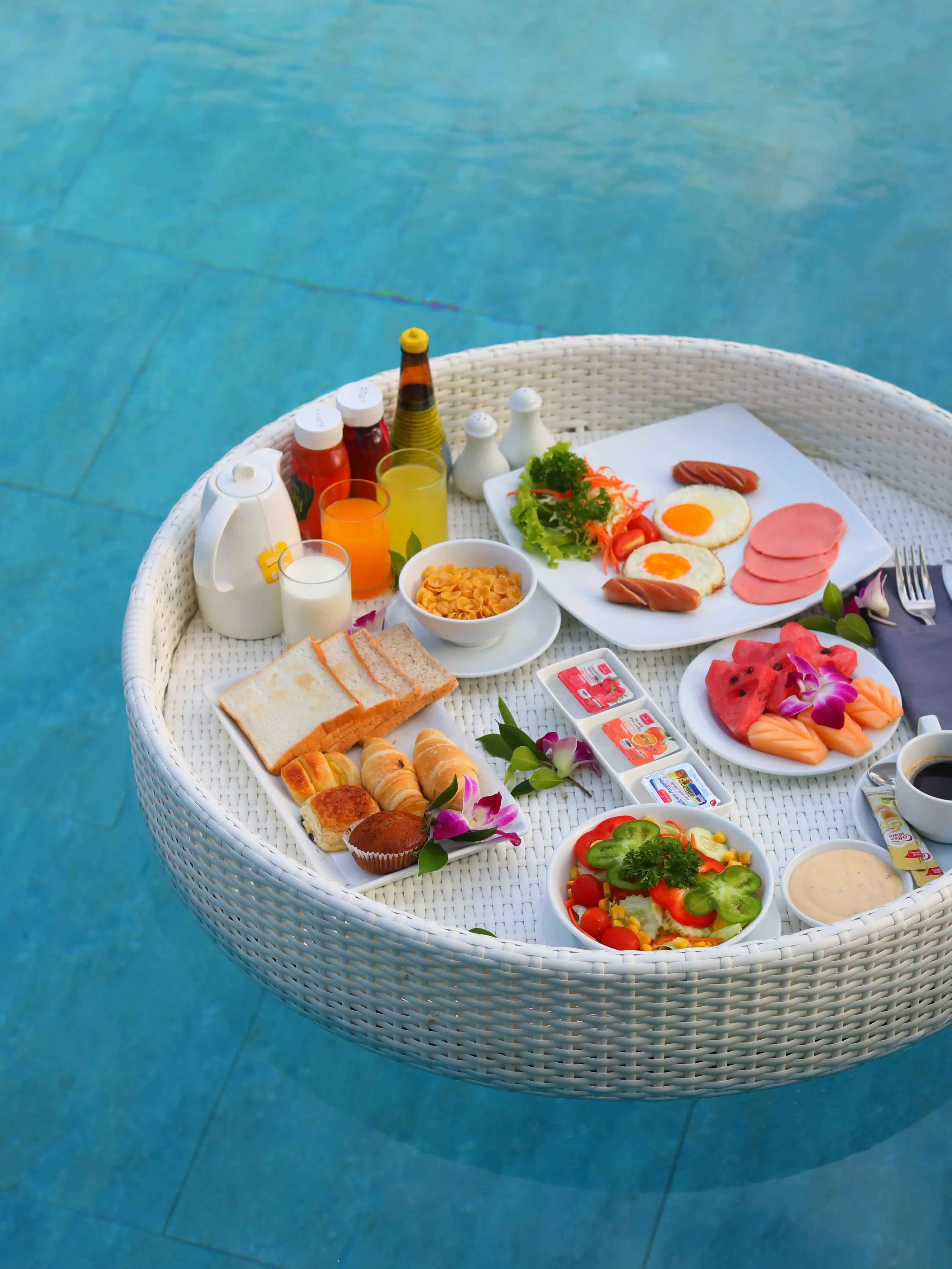 Breakfast floating on a pool